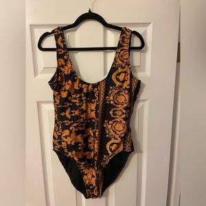 Bodysuit or swimsuit. Fun print!